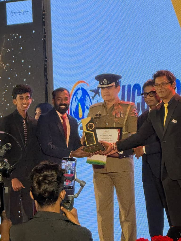 Succeed Travel and Tour receiving the award at the ceremony